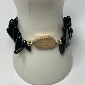 Plunder bracelet black beads in gold tone setting stretch style costume jewelry